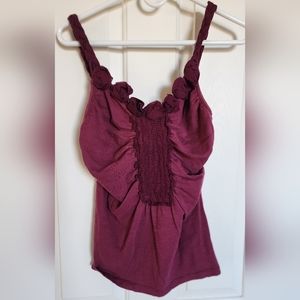So cute! burgundy colored tank top with fun details. Size M